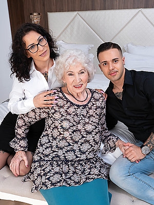 Horny granny gets it in a threesome with a tatooed younger couple